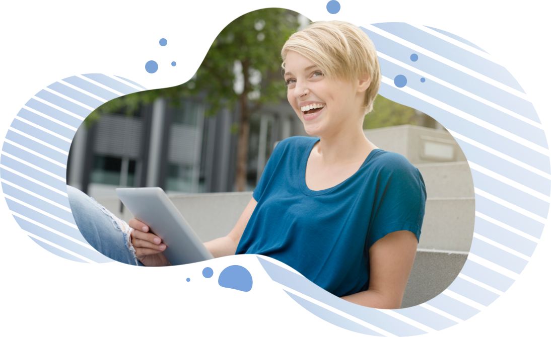 Woman smiling while holding a tablet