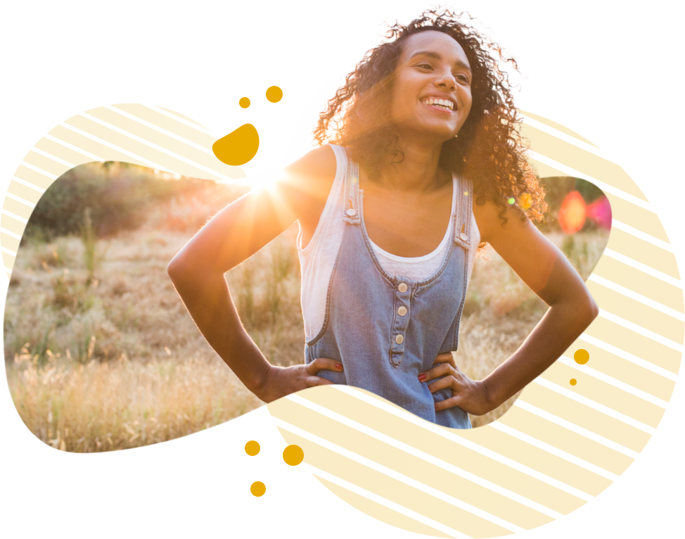 Woman smiling with sunlight in the background